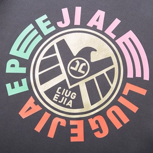 Oversized dark gray hoodie featuring a golden eagle crest and colorful letter printing
