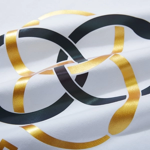 T-shirt en coton blanc avec imprimés circulaires entrelacés en feuille d'or et bleu