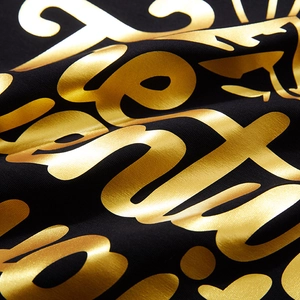 Übergroßes schwarzes T-Shirt mit metallischem Goldbuchstaben-Druck im lockeren Streetwear-Stil
