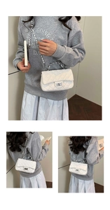 Detailed view of white quilted chain bag with silver twist lock and woven metal strap