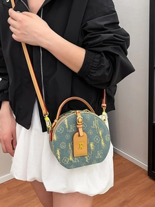 Borsa a tracolla rotonda in denim blu retrò con finiture in pelle marrone e jacquard