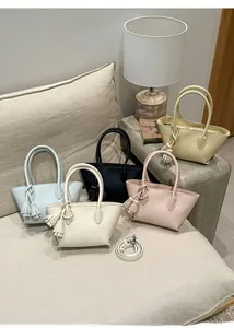 Litchi pattern leather tote bags with tassels in multiple colors for spring 2026