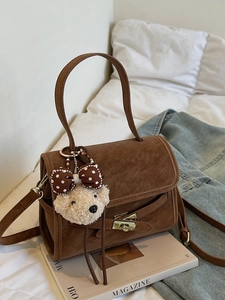 Retro brown faux leather shoulder bag with plush bear charm and metallic buckle