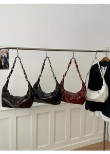 Collection of minimalist hobo shoulder bags in brown, black, burgundy and white leather