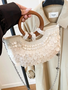 Elegant cream sequin evening handbag with resin ring handles and silver chain strap
