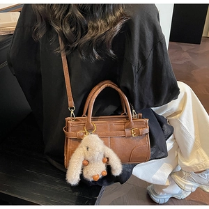 Brown vintage PU leather handbag with metal buckle strap and cute plush rabbit charm