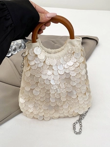 Bohemian sequin handbag with mother-of-pearl finish and round wooden handle detail