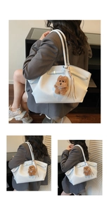 Detail of white tote bag with brown plush bear charm and woven tassel accent