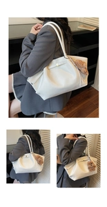 Detail of white pleated cloud tote bag with brown plush bear charm and thin shoulder straps