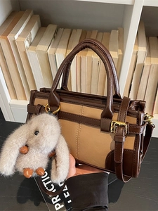 Retro color-block handbag in brown and beige with a plush rabbit charm for daily commuting