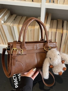 Vintage brown PU leather handbag with adjustable strap and plush rabbit charm