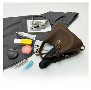 Interior view of brown lychee leather bucket bag showing large capacity for daily items