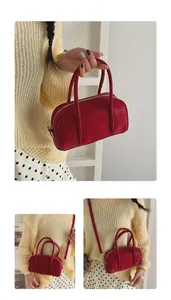 Three-way view of a red rectangular handbag showing top handles and adjustable strap