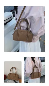 Brown Boston bag in vintage style shown in various lifestyle and street fashion settings