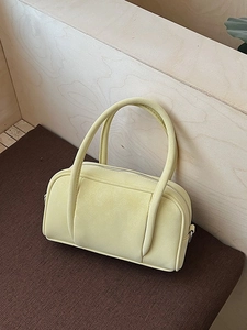 Pale yellow retro Boston handbag in matte PU leather with slim top handles and zippers