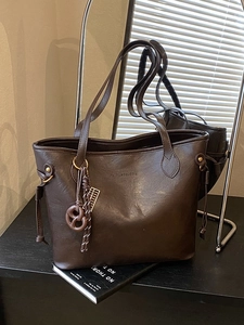Vintage large dark brown leather tote bag with side drawstrings for commuting