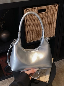 Modern silver metallic hobo bag with sleek mirror finish for women stylish city look
