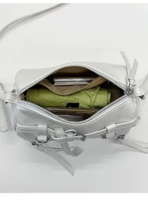 Interior view of white leather motorcycle bag showing storage for umbrella and makeup