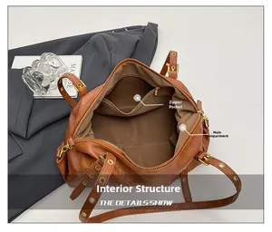 Top view of brown retro Boston bag interior showing spacious main pocket and zipper pocket