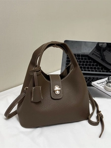Vintage dark brown pebble leather bucket bag with top handle and crossbody strap