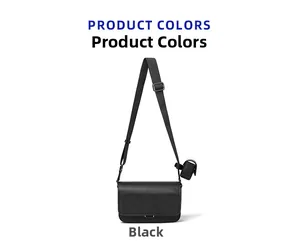 Detail of black pebbled leather crossbody bag with adjustable strap and small coin pouch