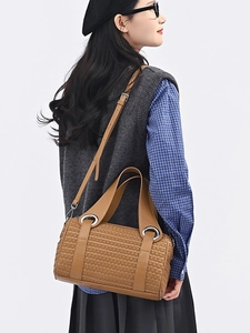 Brown woven Boston bag with silver metal rings and detachable strap for women