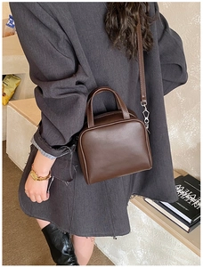 Chic brown leather square crossbody bag styled with a grey oversized blazer