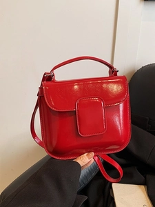 Glossy red oil wax leather handbag with silver hardware and detachable crossbody strap