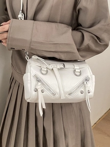 Chic white cylinder tote bag with vintage rivets and decorative zippers for daily commute