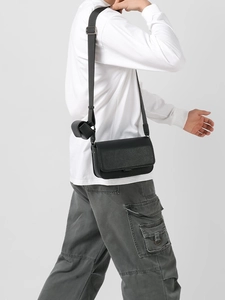 Classic black leather crossbody bag for men with adjustable strap and small coin pouch