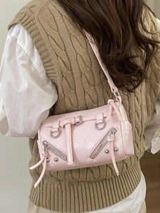 Pink Y2K motorcycle tote bag with studs and silver hardware shown on model