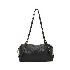 Minimalist black pebble leather shoulder bag with gold metal eyelets and adjustable straps