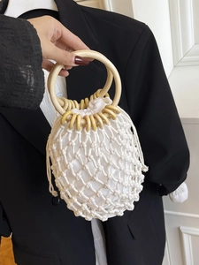 Handmade woven cotton tote with wooden ring handles and drawstring liner in cream white