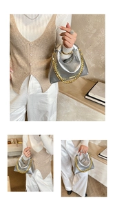 Detail of silver metallic handbag with crinkled texture and bold gold chain strap