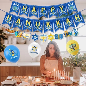 Hanukkah party decor set with Happy Hanukkah banner and festive balloons in a cozy kitchen