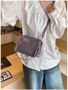 Lavender purple square crossbody bag with gold hardware and stylish rivet details