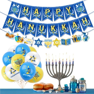 Hanukkah party set with blue banner, gold hanging swirls and festive balloons decoration