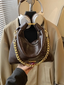 Vintage dark brown patent leather hobo bag with thick gold chain and shoulder strap