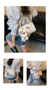 Detailed views of white bowling bag with litchi texture and cute plush dog charm