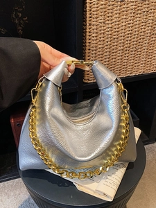 Silver metallic ruched shoulder bag with chunky gold chain strap and top metal clasp