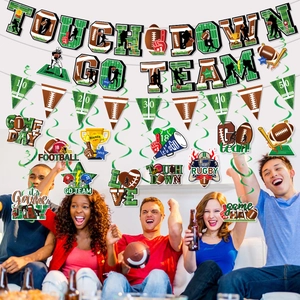 Football party decorations set with Touchdown banners and hanging swirls in a home setting