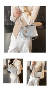 Detailed views of light blue matte shoulder bag with golden twist lock and adjustable strap