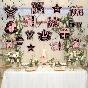 50th birthday party hanging swirl decorations in rose gold and black for 1976 vintage theme