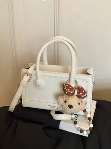 Cream white small rectangular leather handbag with cute bear charm and bead chain