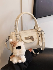 Cream ballet bowling bag in textured leather with plush charm and silver hardware