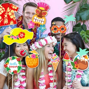 Hawaiian party photo booth props with tiki mask and pineapple for summer beach decorations