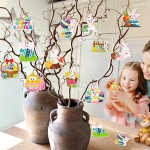 Women and girl decorating dry branches with colorful Easter bunny and egg ornaments