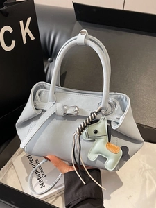 Minimalist light blue handbag with cute horse charm and stylish metal buckle detail