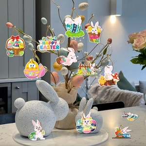 Detailed view of colorful Easter ornaments with rabbits and eggs on decorative branches