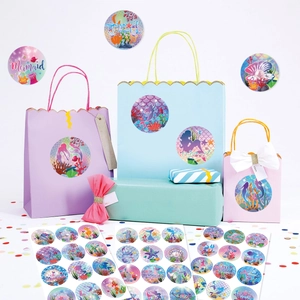 Mermaid party stickers with glitter effect on gift bags and boxes in dreamlike colors